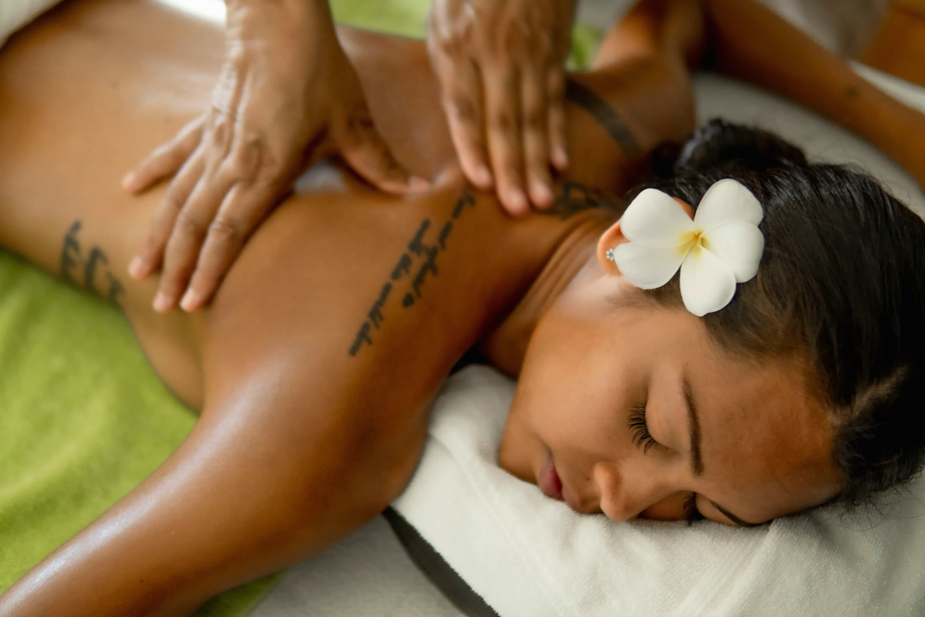 A guest relaxing during a back massage at Lavella Spa